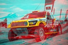 Brutal athletic man making pull-up exercises on a crossbar at outdoor streeet gym. Back view.