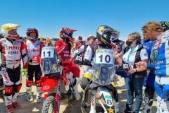 Riders-line-up-with-FIM-CRO-Marie-Hervegault-at-the-start-of-the-Prologue.